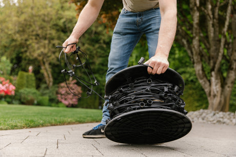 Man unspooling an E17 Socket Base Spool