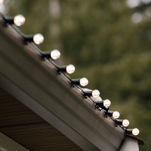 Commercial-Christmas-E17-Base-Wire-With-G30-Lit-Warm White-Bulbs-On-Roofline-Medium-Shot-In-Use