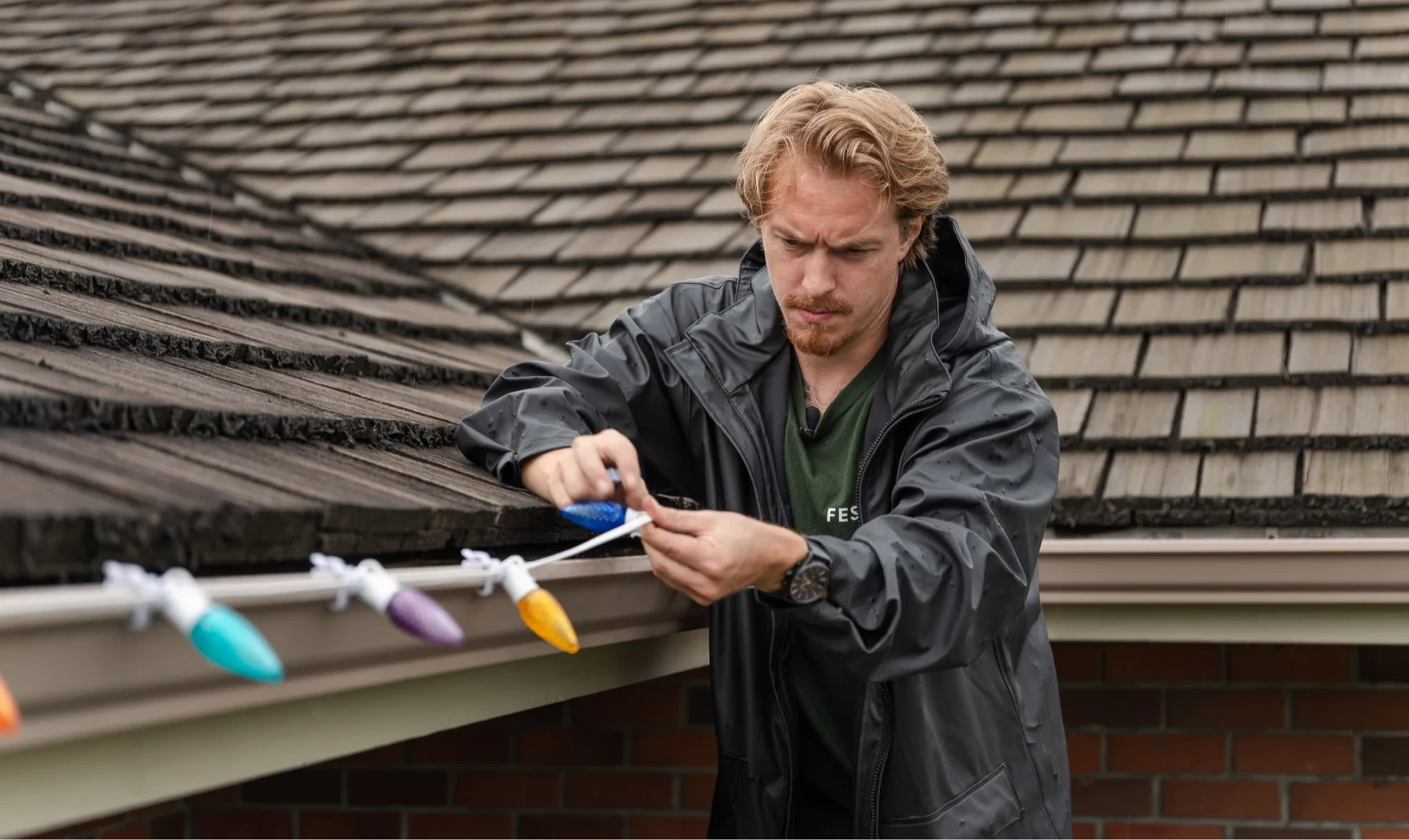 Professional installer fitting roofline lights